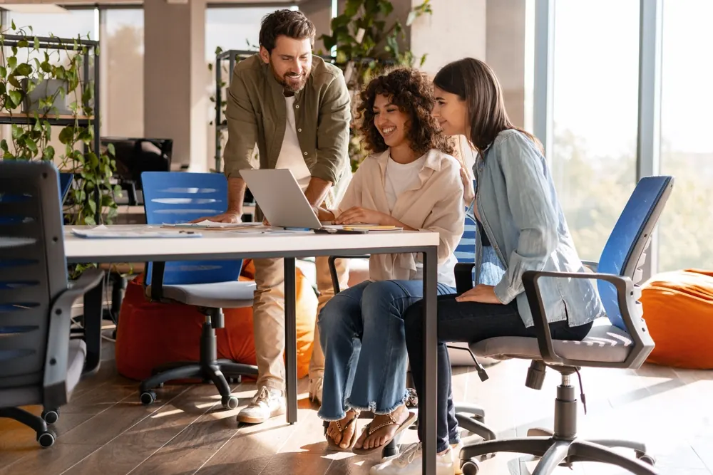 Agency team collaborating around a table